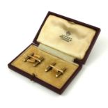 DEAKIN & FRANCIS, A PAIR OF 9CT GOLD ENGINE TURNED CUFFLINKS Encased in an Asprey box.