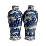 A PAIR OF 19TH CENTURY CHINESE BLUE AND WHITE BALUSTER VASES Having two cartouche panels decorated