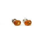 A PAIR OF SILVER CITRINE STUDS.