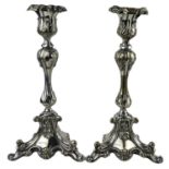 A PAIR OF ROCOCO STYLE SILVER PLATED CANDLESTICKS. (h 28cm)