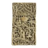 A 19TH CENTURY CHINESE IVORY CARD CASE, carved with figural landscape. (9.6cm x 5.7cm)