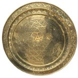 A LARGE DECORATIVE EMBOSSED COPPER CHARGER Decorated with floral leaves and star patterns. (diameter