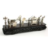 A CHINESE SILVER PALANQUIN AND PROCESSION ON HARDWOOD STAND Bearing maker's mark to base. (length