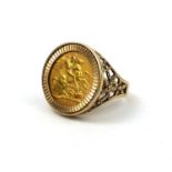 AN ELIZABETH II 22CT GOLD 1968 SOVEREIGN RING Encased in a 9ct gold filigree mount. (16.6g)