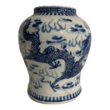 A 19TH CENTURY CHINESE BLUE AND WHITE GINGER JAR Decorated with dragons chasing the pearl of wisdom,