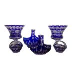 A COLLECTION OF BOHEMIAN COBALT BLUE CRYSTAL CUT GLASS To include a large pair of urns and four of