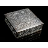 A SRI LANKAN CEYLON SILVER BOX Decorated with chased scrolling foliage and flowers surrounded by