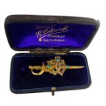 A VICTORIAN 15CT GOLD, SEED PEARL AND TURQUOISE BROOCH in the form of a sword. Gross weight- 4.7g