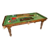 E.J. RILEY LTD, AN EARLY 20TH OAK SNOOKER DINING TABLE Complete with two extra leaves, concealing