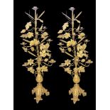 A PAIR OF LARGE LATE 19TH CENTURY BRASS NINE BRANCH CANDELABRAS Decorated with oak leaves, wheat