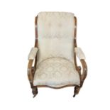 A VICTORIAN MAHOGANY OPEN ARMCHAIR With scroll back and arms, in a cream floral fabric