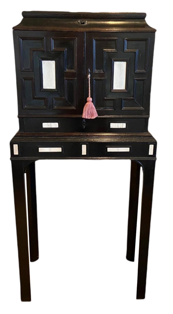 A RARE 17TH CENTURY EBONY IVORY AND EMBROIDERED RAISED WORK ANTWERP CABINET ON STAND The rise and