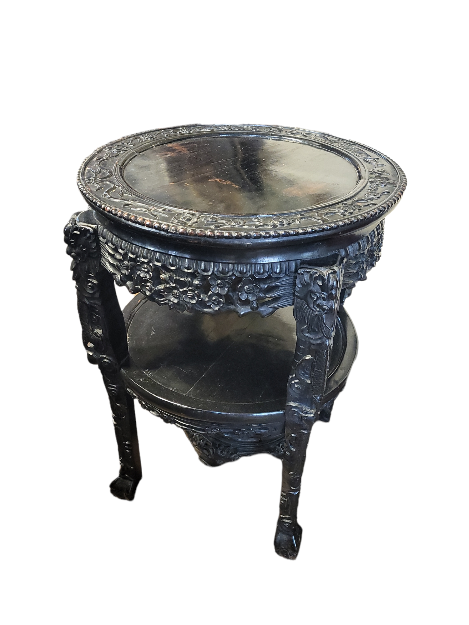 A 19TH CENTURY CHINESE HEAVILY EBONISED HARDWOOD CIRCULAR TWO TIER TABLE With pierced gallery, on