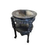A 19TH CENTURY CHINESE HEAVILY EBONISED HARDWOOD CIRCULAR TWO TIER TABLE With pierced gallery, on