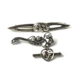 GEORG JENSEN, THREE VINTAGE DANISH SILVER BROOCHES Having pierced organic form decoration. (