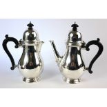 AN EARLY 20TH CENTURY GEORGIAN DESIGN SILVER CAFÉ AU LAIT SET Comprising a coffee pot and hot milk