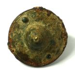 A SMALL ANCIENT TRIBAL METAL CLASP FORMED AS A SHIELD. (diameter 5cm) Condition: good