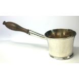 A LATE 18TH/EARLY 19TH CENTURY WHITE METAL BRANDY A spherical pan with turned wooden handle,