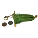 A 19TH CENTURY GILT METAL MISER'S PURSE Set with two pairs of hands and ring seal on green fabric