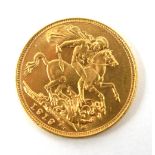 AN EARLY 20TH CENTURY 22CT GOLD FULL SOVEREIGN COIN, DATED 1919 With a King George V portrait and