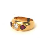 A VINTAGE 18CT GOLD, DIAMOND AND RUBY RING The central round cut diamond flanked by heart form