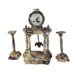 AN EARLY 20TH CENTURY VARIEGATED MARBLE PORTICO CLOCK GARNITURE SET Architectural form, with