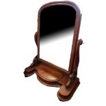 A VICTORIAN MAHOGANY DOMED DRESSING TABLE MIRROR Supported on a serpentine base with a single