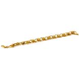 A FINE 22CT GOLD FANCY LINK BRACELET Composed of a continuous row of graduated openwork links,