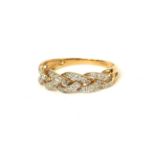 A VINTAGE 9CT GOLD AND DIAMOND RING The arrangement of round cut diamonds in a twist design. (approx