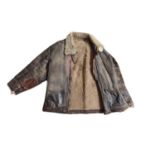 A VINTAGE BROWN FLYING JACKET Fur lined collar and interior. Condition: worn throughout with repairs