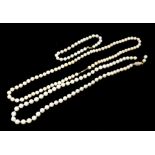 TWO VINTAGE CULTURED PEARL NECKLACES One on a 9ct gold clasp, along with a pearl bracelet.