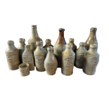 A MIXED SELECTION OF MID VICTORIAN FOURTEEN STONEWARE SALT GLAZED ALE AND SPIRIT BOTTLES To