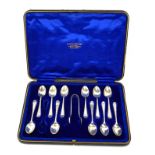 A SET OF EDWARDIAN SILVER TEASPOONS AND SUGAR TONGS Having engraved decoration, hallmarked Cooper