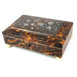 A FINE MID VICTORIAN TORTOISESHELL RECTANGULAR JEWELLERY CASKET The cover inlaid with mother of