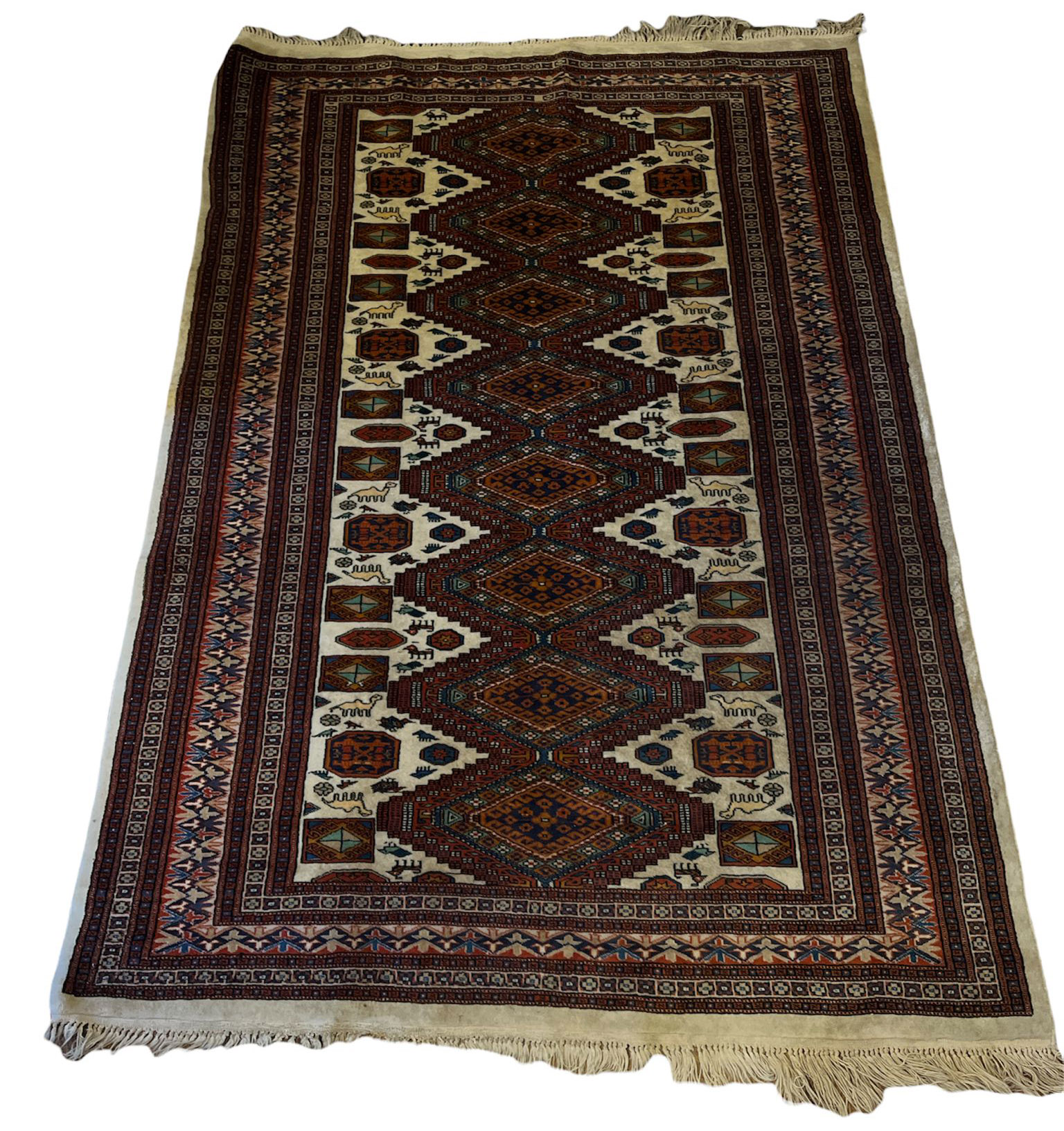 A MID 20TH CENTURY TABRIZ NORTHWEST PERSIAN WOOLEN CARPET Centred with cartouche panels of flowering
