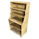A VICTORIAN PINE OPEN WATERFALL BOOKCASE. (60cm x 35cm x 108cm) Condition: some light marks