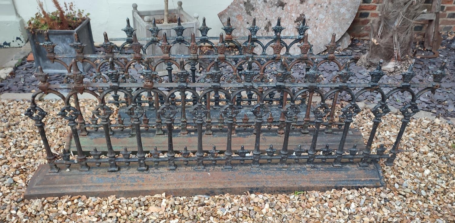 A SET OF VICTORIAN GOTHIC STYLE CAST IRON RAILINGS In three sections. (475cm) Condition: some