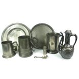 A COLLECTION OF 18TH CENTURY AND LATER PEWTER WARE Comprising a quart tankard with glass bottom, a