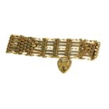 A VINTAGE 9CT GOLD GATE SEVEN BAR BRACELET. (19cm) Condition: good throughout