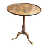 A 19TH CENTURY MAHOGANY DISH TILT TOP OCCASIONAL TABLE On turned column with three splayed legs. (