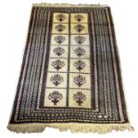 A MID 20TH CENTURY WEST PERSIAN KURDISTAN WOOLEN CARPET OF TRADITIONAL DESIGN Decorated with