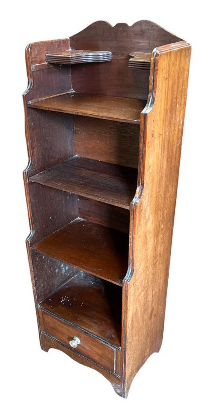 A 19TH CENTURY MAHOGANY WATERFALL BOOKCASE With open shelves above a single drawer, raised on