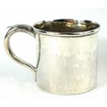 AN 18TH CENTURY WHITE METAL SMALL SPHERICAL TANKARD With a single handle and engraved crest,