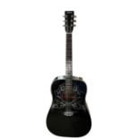 EROS, A VINTAGE ACOUSTIC GUITAR Matt black finish decorated with flowers and fauna, on stand.