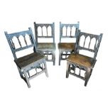A SET OF FOUR ANTIQUE OAK CHAIRS With spindled arched backs and solid seats, on square legs . (