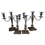 A PAIR OF VICTORIAN SHEFFIELD SILVER PLATE ON COPPER THREE BRANCH TABLE CANDELABRUM Having scrolling