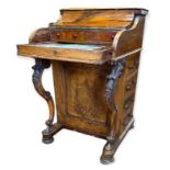 A VICTORIAN WALNUT POP-UP PIANO FRONT DAVENPORT DESK The fitted interior above carved cabriole