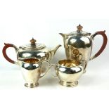 A MID 20TH CENTURY SILVER FOUR PIECE TEA SET Comprising a teapot, hot water jug, sugar basin and