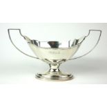 AN EARLY 20TH CENTURY SILVER SUGAR BASIN Classical form, with twin handles and fluted to body,