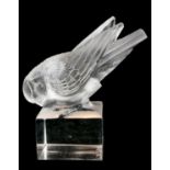 RENÉ LALIQUE, AN ART DECO FROSTED ART GLASS BIRD MODEL On a crystal clear square base, bearing